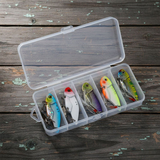 Norte 5-Piece Metal VIB Blade Bait Set in a clear tackle box organizer on a rustic wooden background.