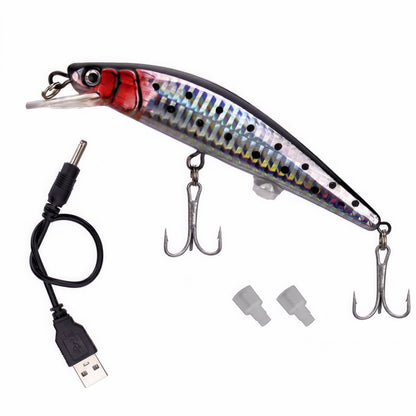 Silver and red electronic tremor minnow fishing lure with USB charging cable, treble hooks, and protective caps on a white background.