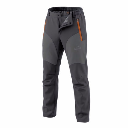 Front studio view of Norte Outdoors Ascent V4.0 men's dark grey waterproof hiking pants on a white background, featuring orange zipper details and contrasting knee patches.