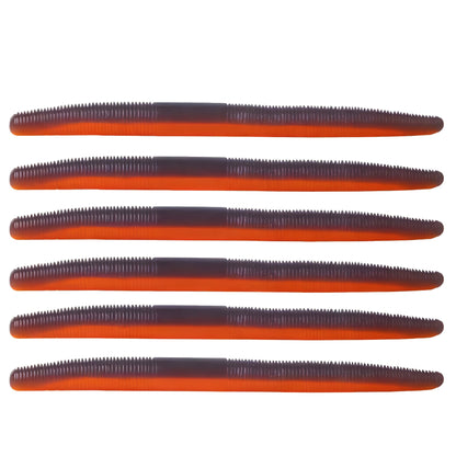 Pack of six soft plastic stick baits in a black and orange laminate color for bass and walleye fishing.