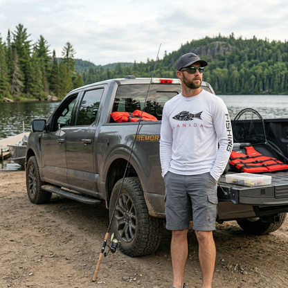Norte technical outdoor apparel for men shown in a rugged lakeside setting with adventure vehicle, highlighting durable gear for fishing and hiking.